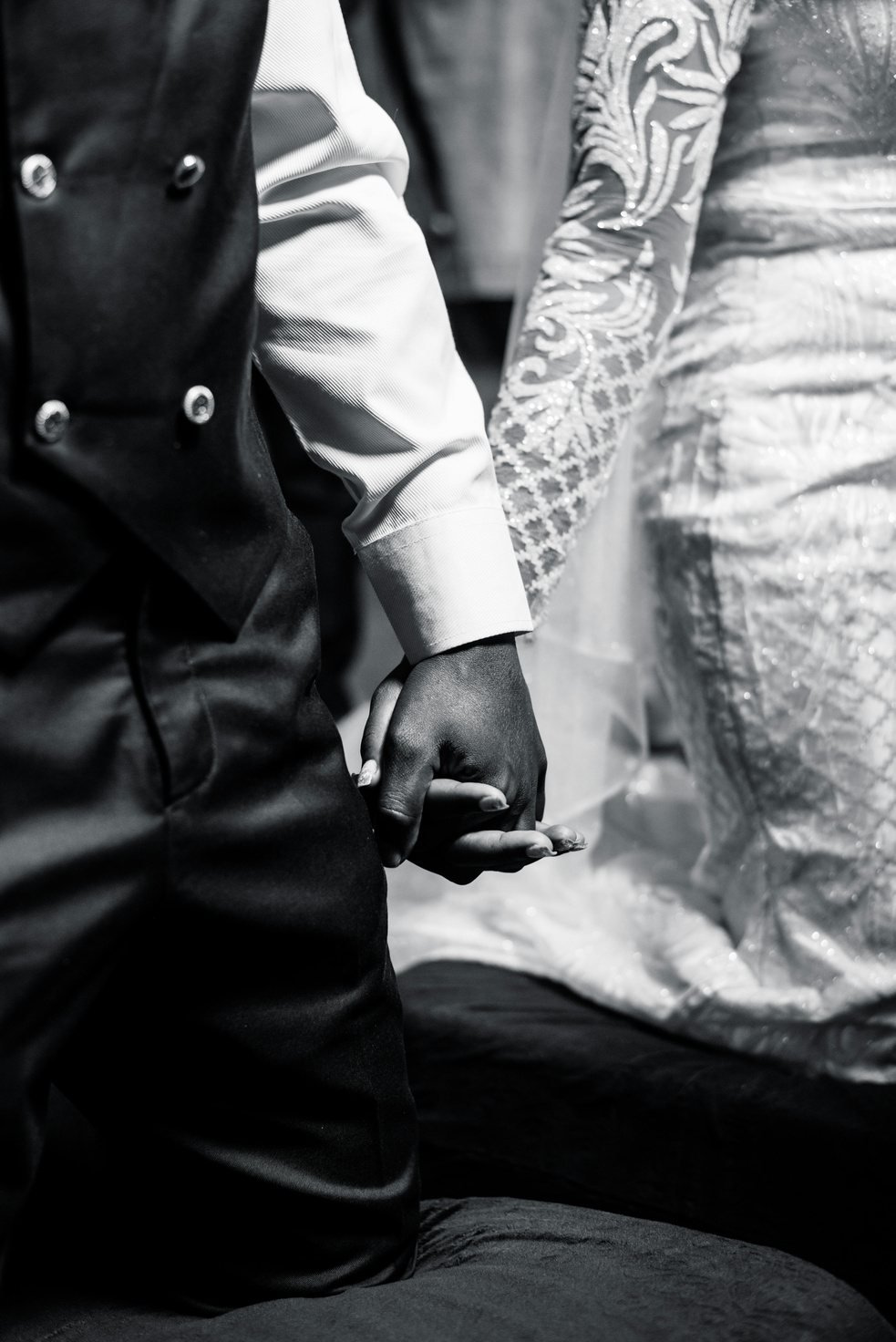 A bride and groom holding hands
